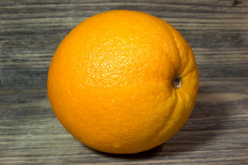 Orange fruits on wooden background