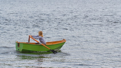 Naklejka premium Girl in a boat