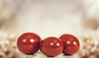 Red Easter eggs on colorful background