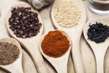 Spices on wooden spoons