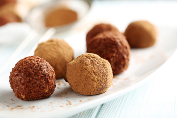 Sweet chocolate truffle on a blue wooden table