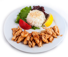 Roasted meat, white rice and vegetables and lemon