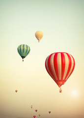 Hot air balloon on sun sky with cloud, vintage and retro filter effect style