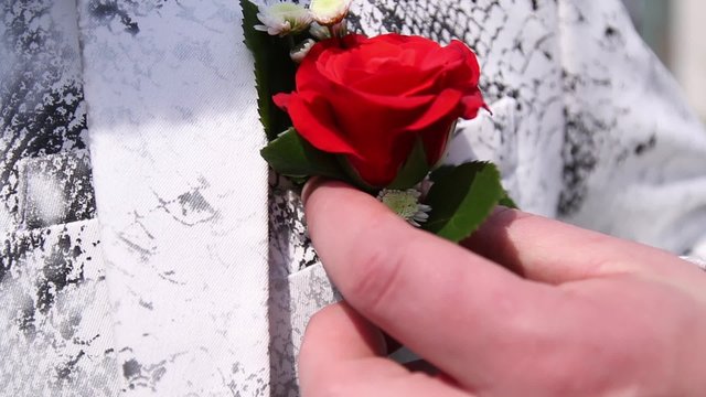 Rose on a white jacket buttonhole