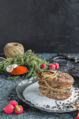 Steak on a metal plate with salt and pepper,garlic
