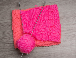 yarns, wool, knitting needles on dark background