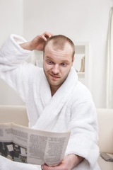 Obraz premium young man with newspaper