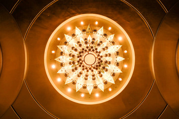 Bottom view of illuminated chandelier..