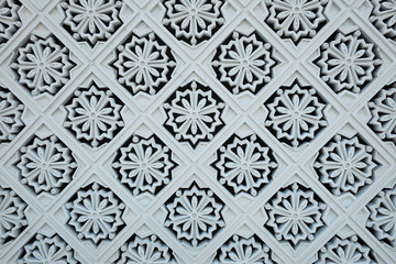 White tile decorations on the outer wall of the New Royal Palace