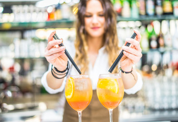 Barmaid preparing cocktails