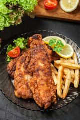 Fried fish in crispy batter with chips