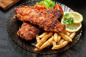 Fried fish in crispy batter with chips