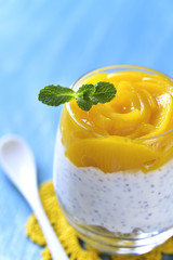 Chia pudding with oat and peach slices.