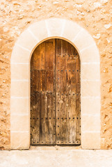 View of an medieval old mediterranean wooden door