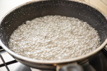Sugar caramelizing in a pan (detail)