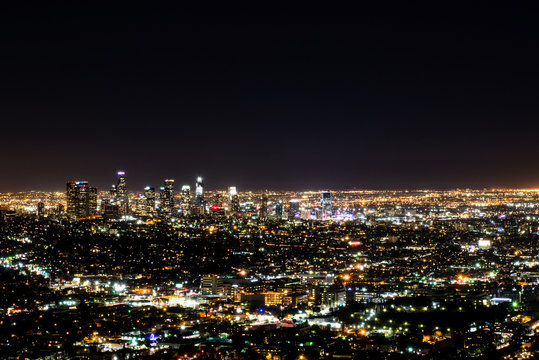 Long exposure night view of Los Angeles downtown and surrounding metropolitan area