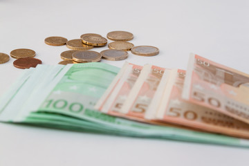 European money with coins in the background
