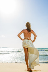 Fototapeta na wymiar Classy woman at the beach Vacation Holiday Concept, Girl with Wi