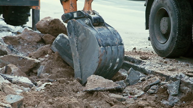 Excavator Digging Road