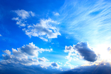 Naklejka na ściany i meble picturesque white clouds on blue sky