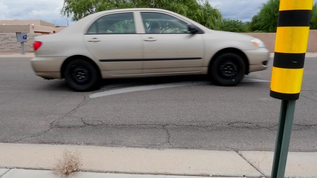 A car going over a speed bump