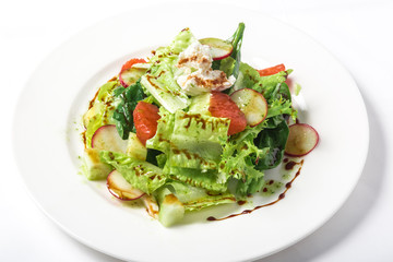 Fresh salad with lettuce, radishes, grapefruit, cheese and citrus dressing
