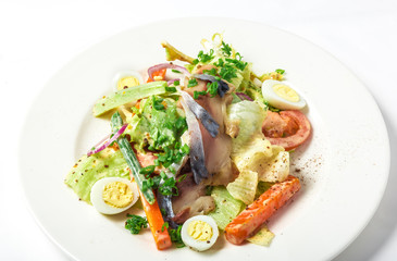 Salad with mackerel fish, zucchini, lettuce, carrots and creamy dressing 