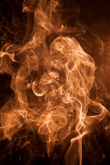 Gold smoke on a black backgroug.