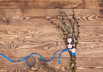 catkins,vine.Easters spring wooden background. greeting easter c