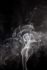 White smoke on a black background.