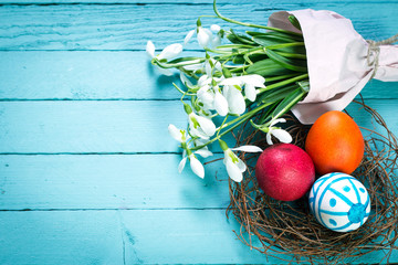 Easter concept with colorful eggs on wooden background