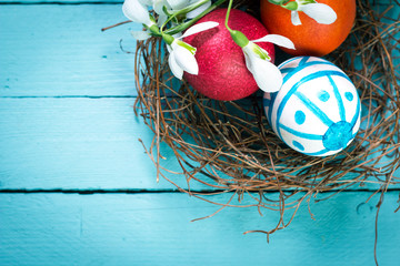 Easter concept with colorful eggs on wooden background