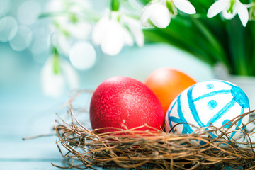 Easter concept with colorful eggs on wooden background