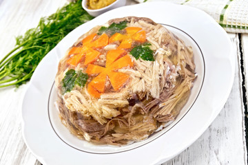 Jellied with carrot in big plate on board