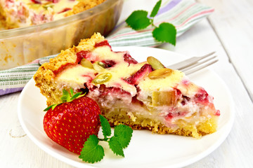 Pie strawberry-rhubarb with cream in white plate