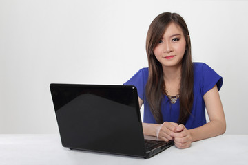 Young Asian woman and her laptop isolated