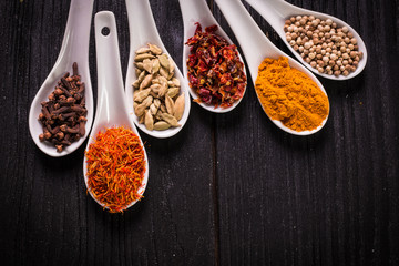 spices and herbs on wooden table , medicinal concept