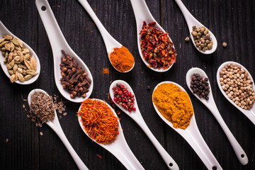 spices and herbs on wooden table , medicinal concept