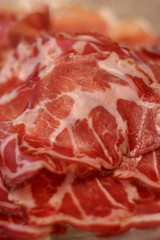 Fresh cold sliced bacon, selective focus, shallow DOF.