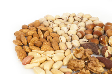 Mixed nuts - almonds, pistachios, hazelnuts, brazil nuts, walnuts, peanuts on the white background, circle, rounded on top