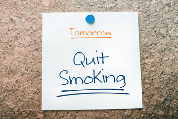 Quit Smoking Reminder For Tomorrow On Paper Pinned On Cork Board