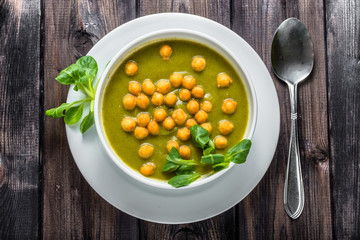 Italian broccoli soup or cream soup on wooden table