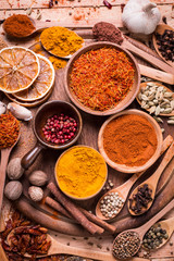 spices and herbs on wooden table.