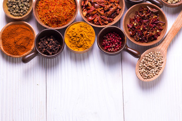 spices and herbs on wooden table.