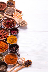 spices and herbs on wooden table.