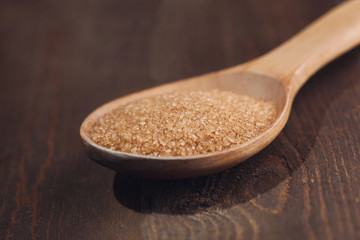 Himalayan salt in wooden spoon. Selective focus
