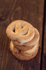 Salted pretzel snacks on the old wooden background