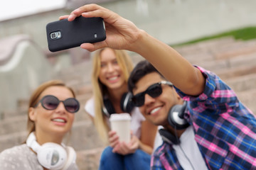 Obraz premium Make selfie photos with friends