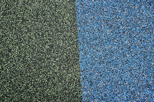 Texture. Childrens playground floor.Rubber and stones.
