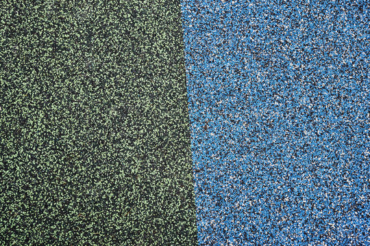 Texture. Childrens playground floor.Rubber and stones.